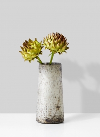 dried artichoke in vintage glass vase